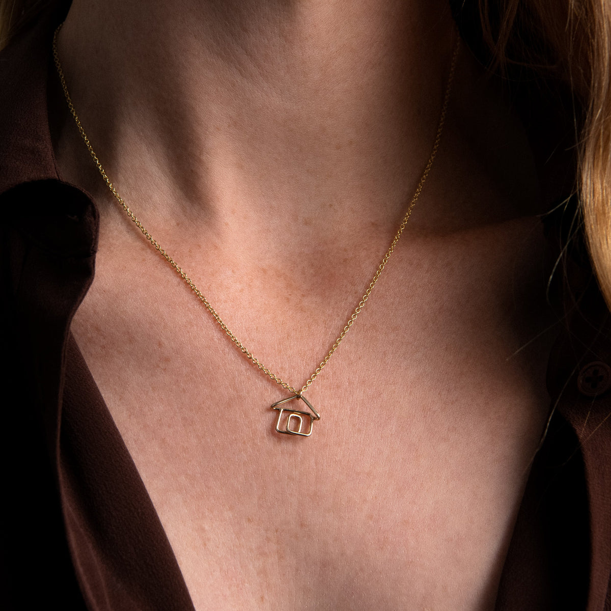 Tiny House Charms Necklace, worn around the neck