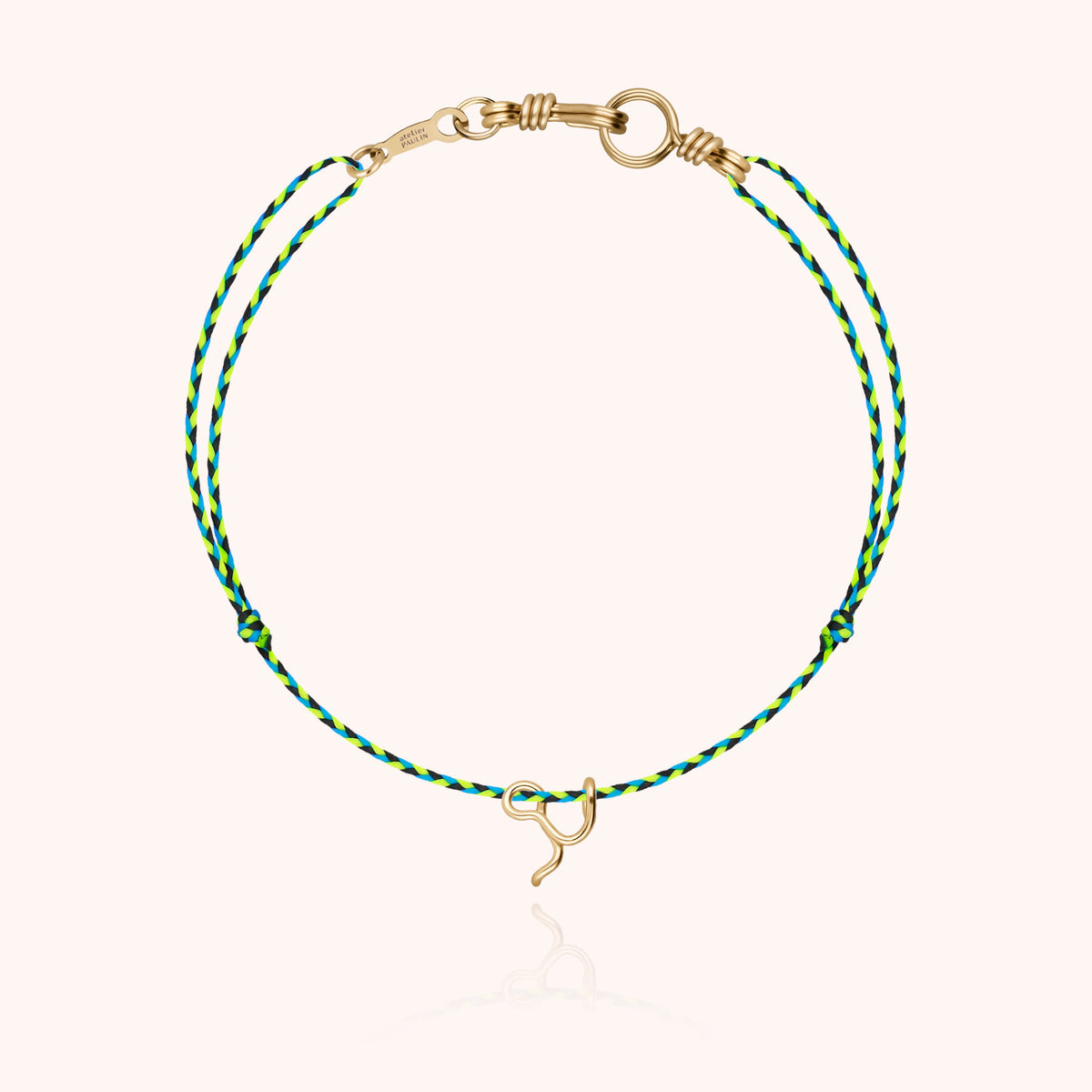 Mini Attache moi Initiale Slim Knot Cord Bracelet, worn on the wrist