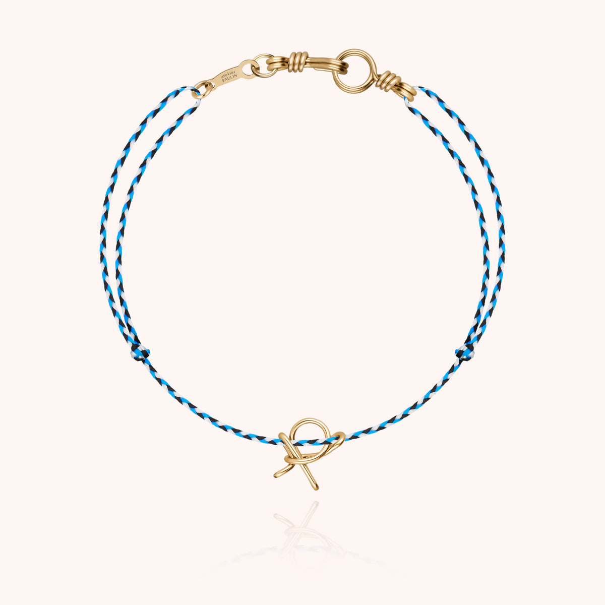 Mini Attache moi Initiale Slim Knot Cord Bracelet, worn on the wrist