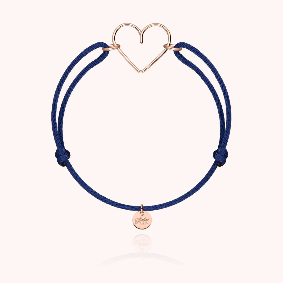 Pendente cuore in filo d'oro rosa laminato 14k su un cordino blu notte