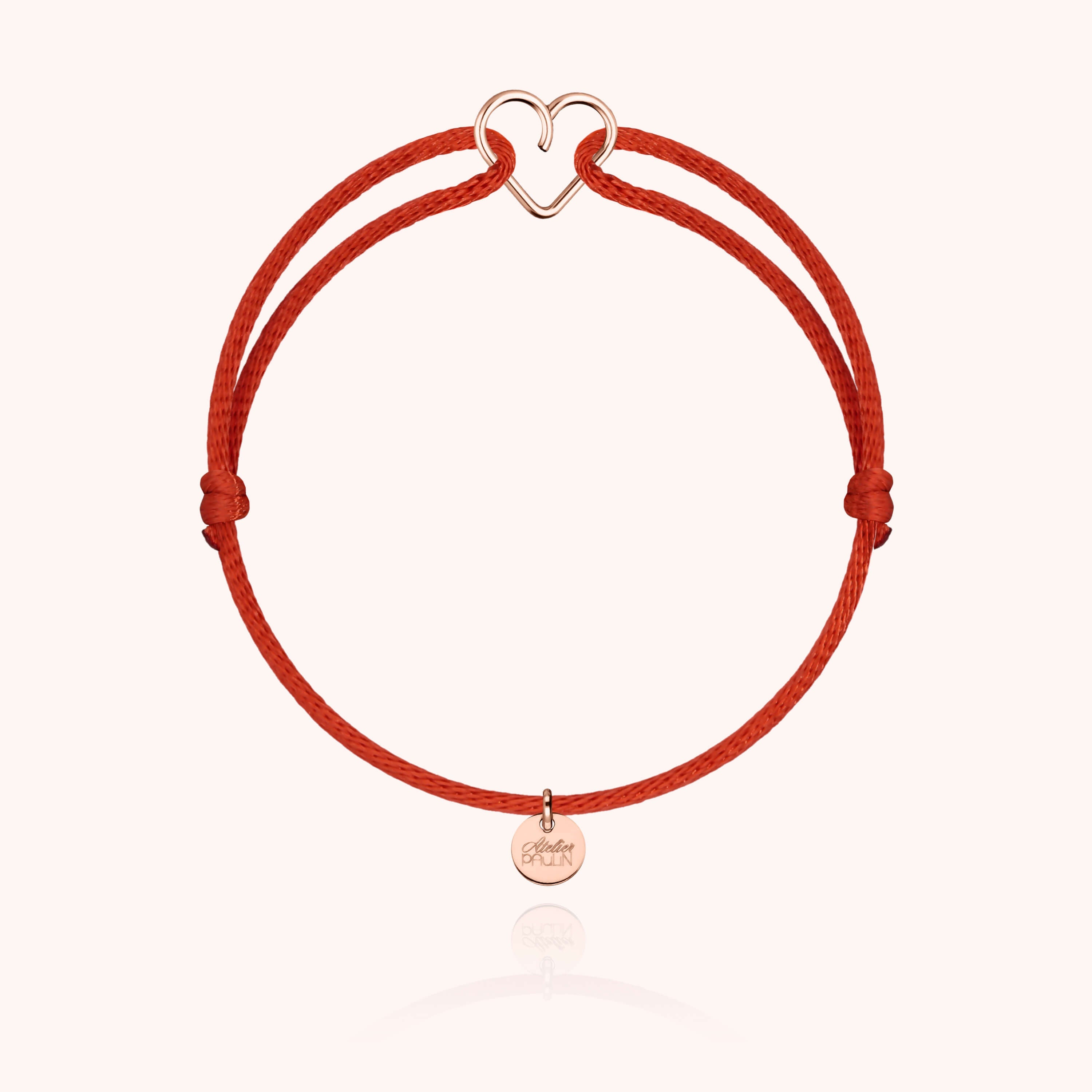 Bracelet Cordon Mini Coeur — détail façonnage à la main, or rose laminé