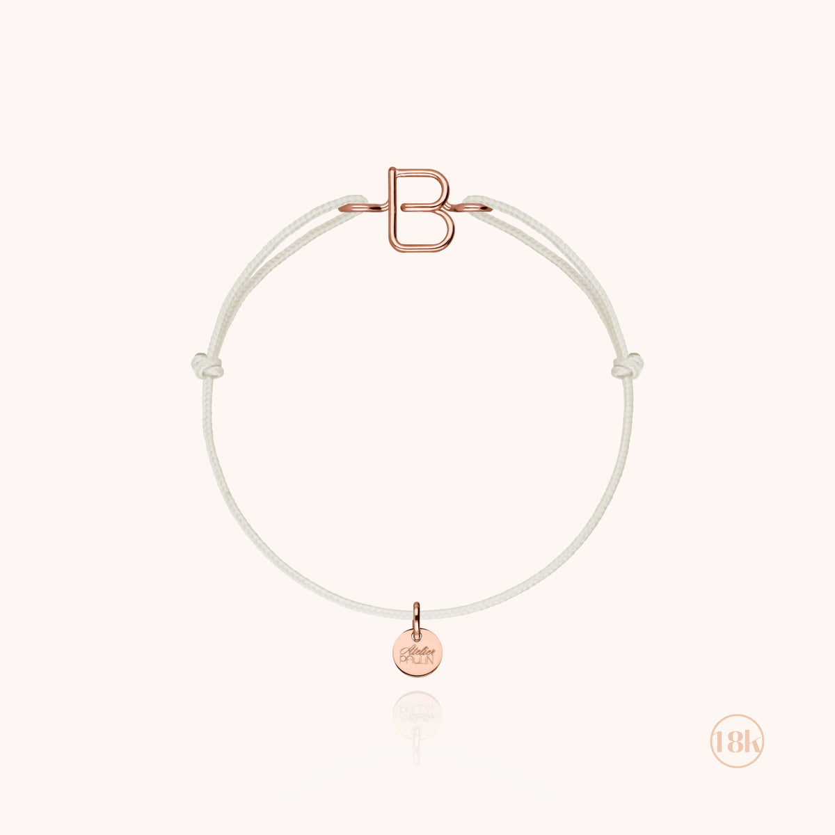 Kordelarmband Initiale Kind aus 18K Roségold — von Hand gefertigtes Schmuckstück Atelier Paulin