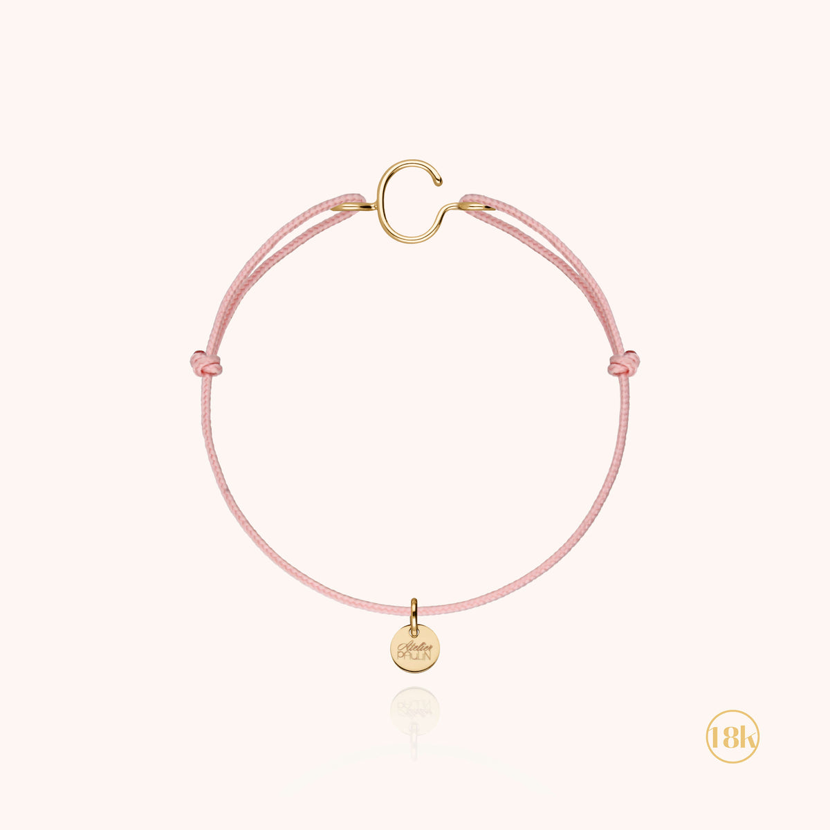 Kinderarmband mit Kordel und Initiale — handgeformte Verarbeitung des Schmuckstücks, 18K Gelbgold