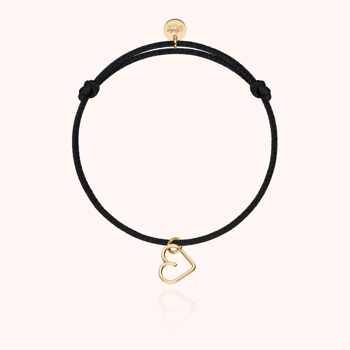 Bracciale Cordino Lucky Charms Cuore con il suo charm cuore in oro su un cordino colorato