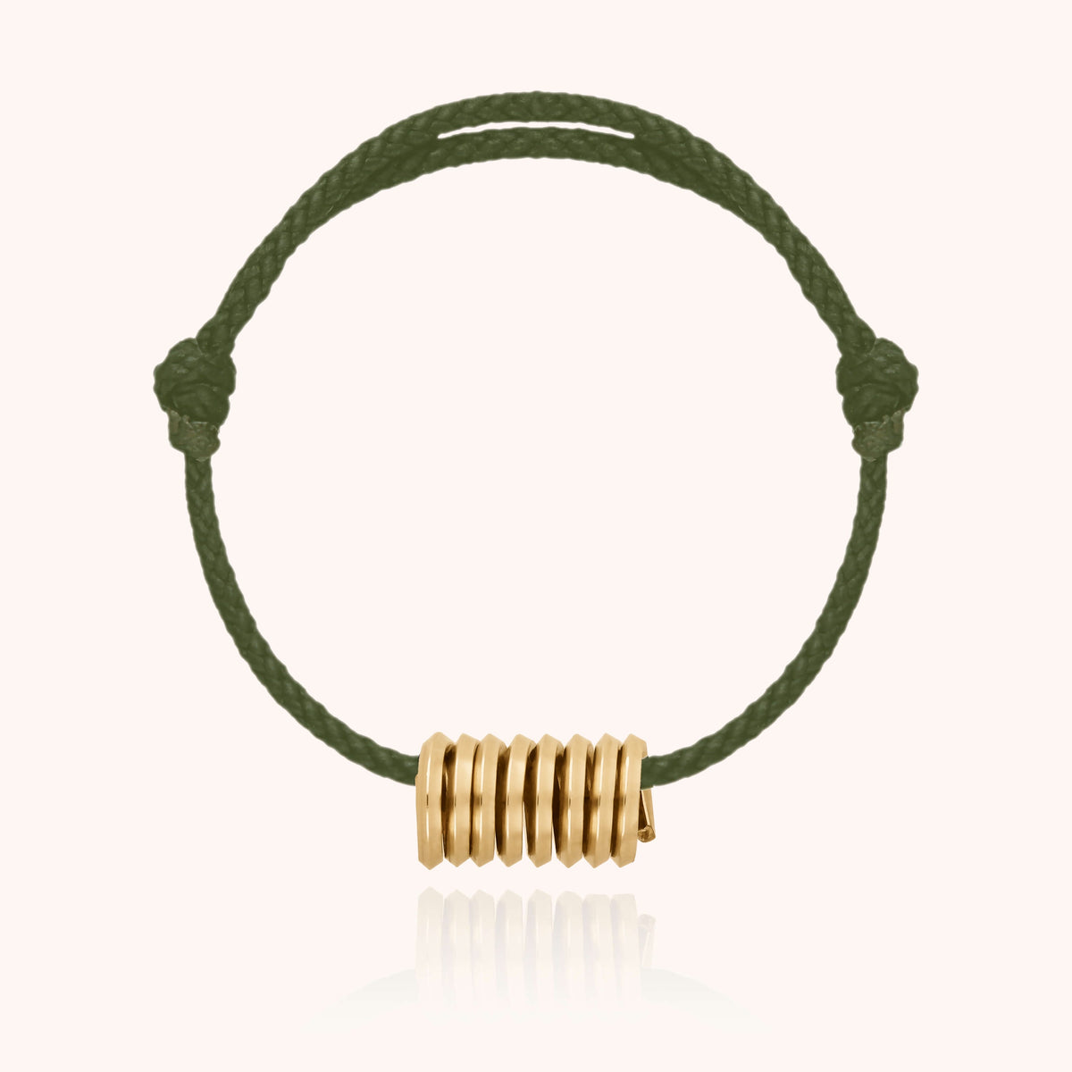 Cord Bracelet Matt in 14k yellow gold-filled wire on a waxed cord, worn on a man's wrist