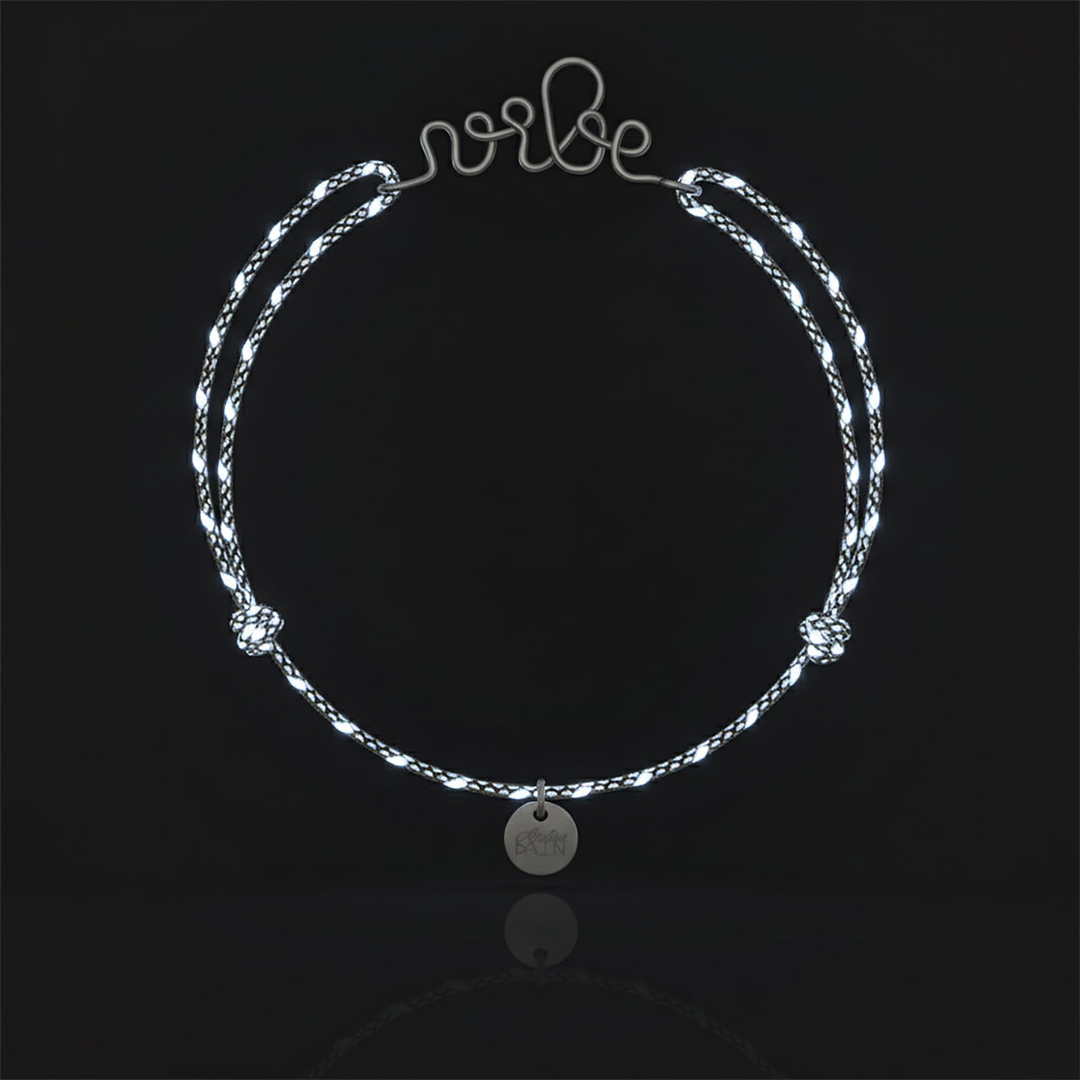 Personalized Reflective Cord Bracelet in sterling silver wire, worn on the wrist
