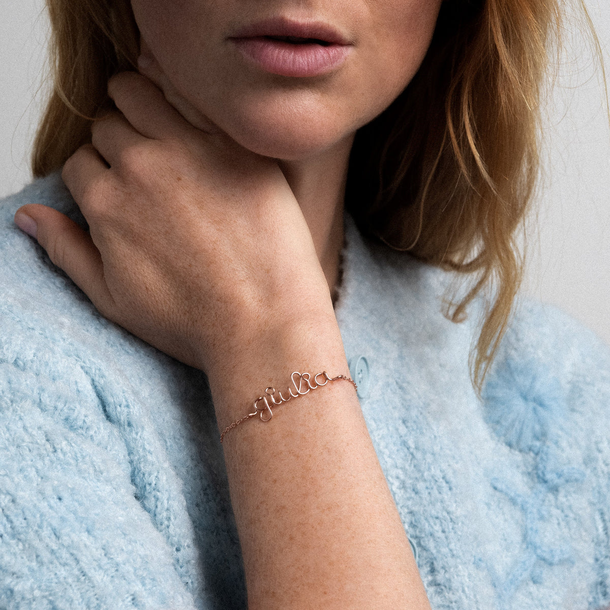 Personalized Richelieu Bracelet in 14k rose gold-filled wire, worn on a woman's wrist
