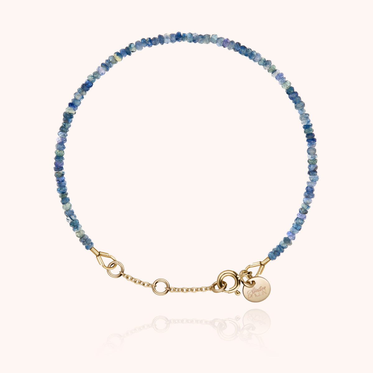 Bracelet Rivière Uni en or jaune laminé, perles de saphir bleu
