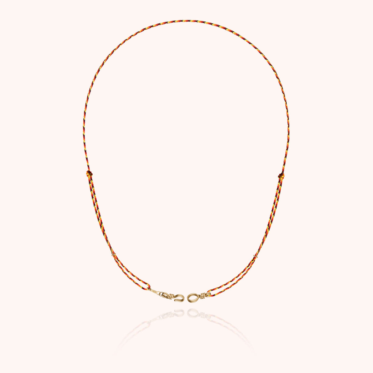 Slim Knot Cord Necklace Attache moi in 14k yellow gold-filled wire, worn around the neck