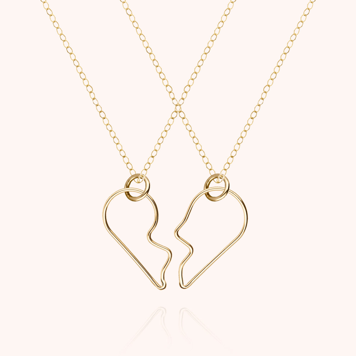 Duo de Colliers Cœur de l'Amour en or jaune laminé, deux demi-cœurs