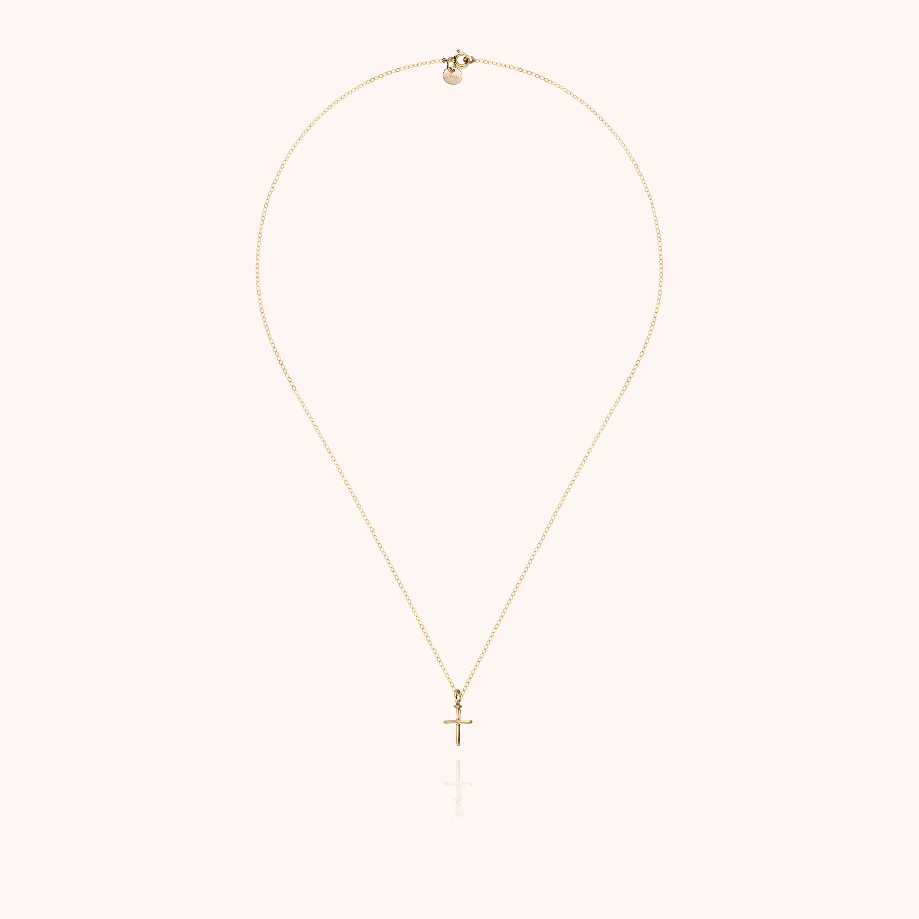 Collier Charms Symbolic Croix porté au cou — or jaune laminé livraison soigneuse garantie