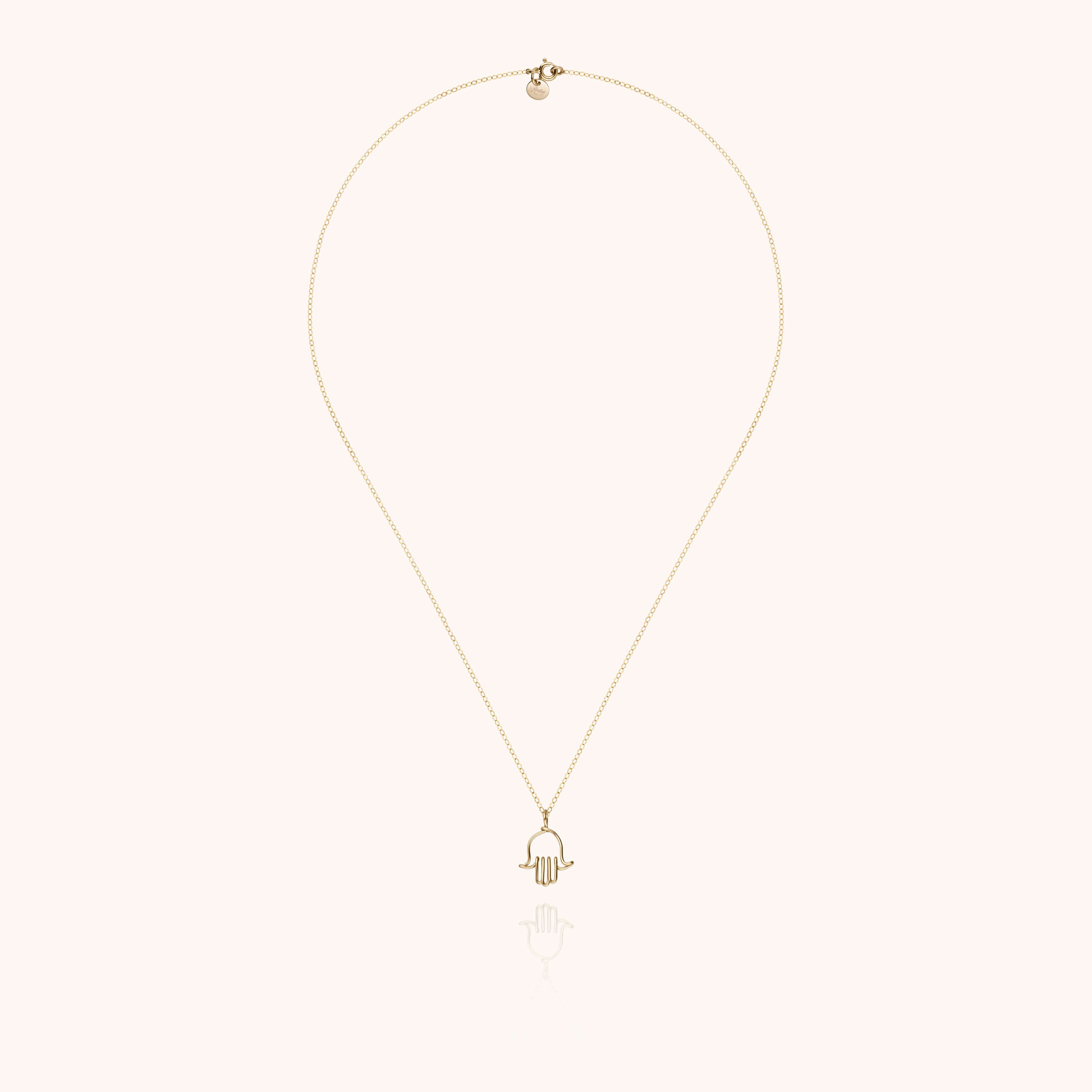 Collier Charms Symbolic Main de Fatma porté au cou — or jaune laminé livraison soigneuse garantie