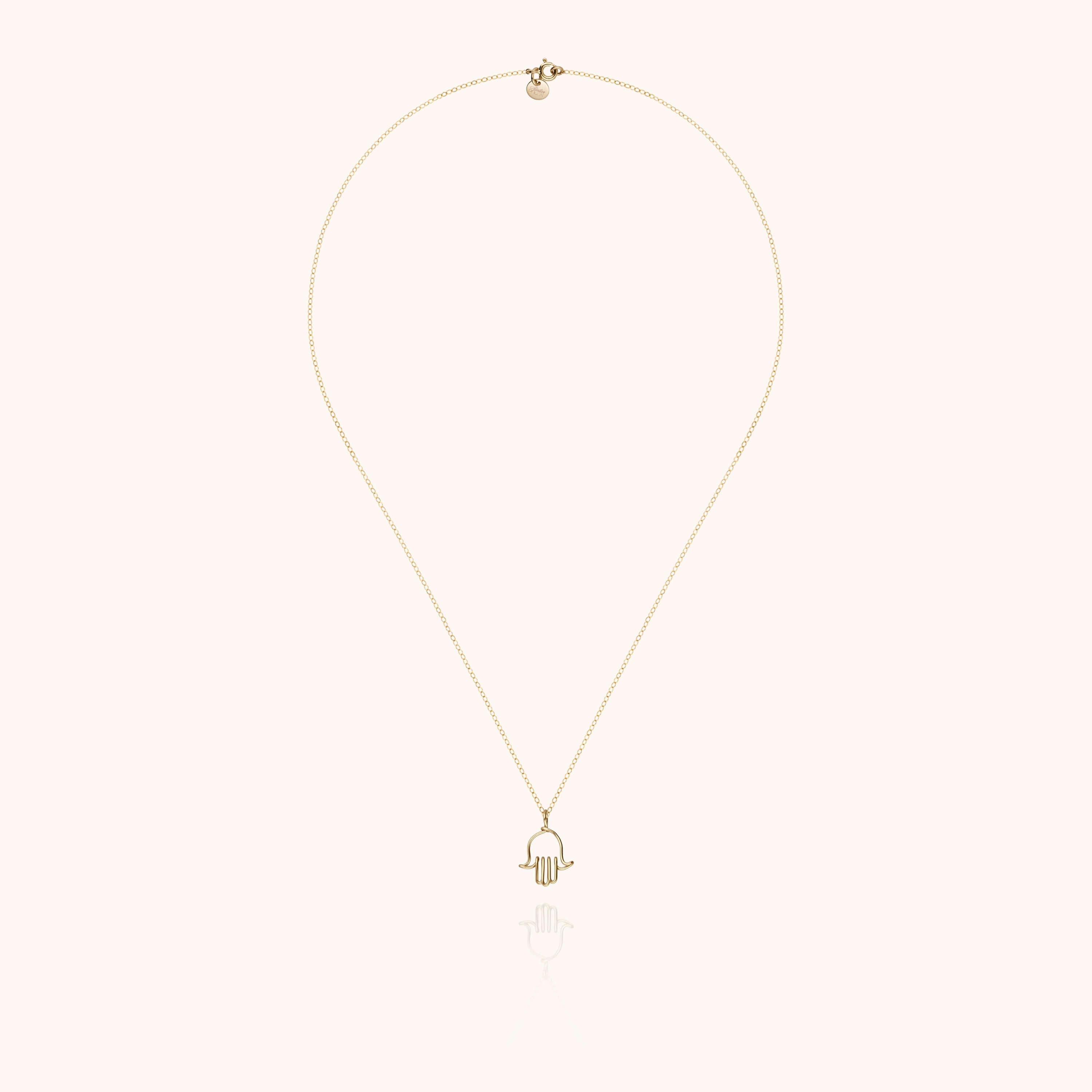 Collier Charms Symbolic Main de Fatma porté au cou — or jaune laminé livraison soigneuse garantie