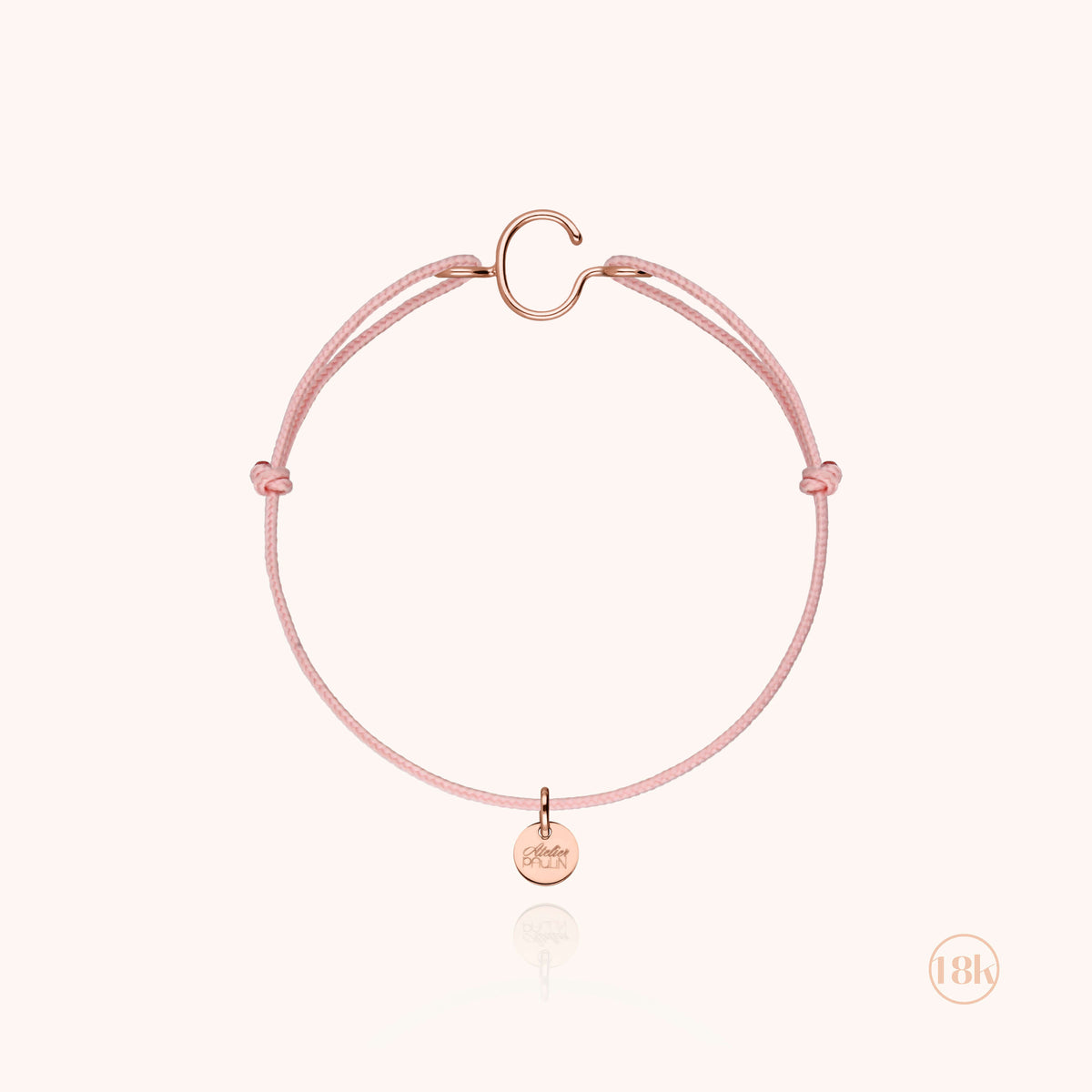 Kinderarmband mit Kordel und Initiale — Detail des Metalldrahts, Roségold 18K