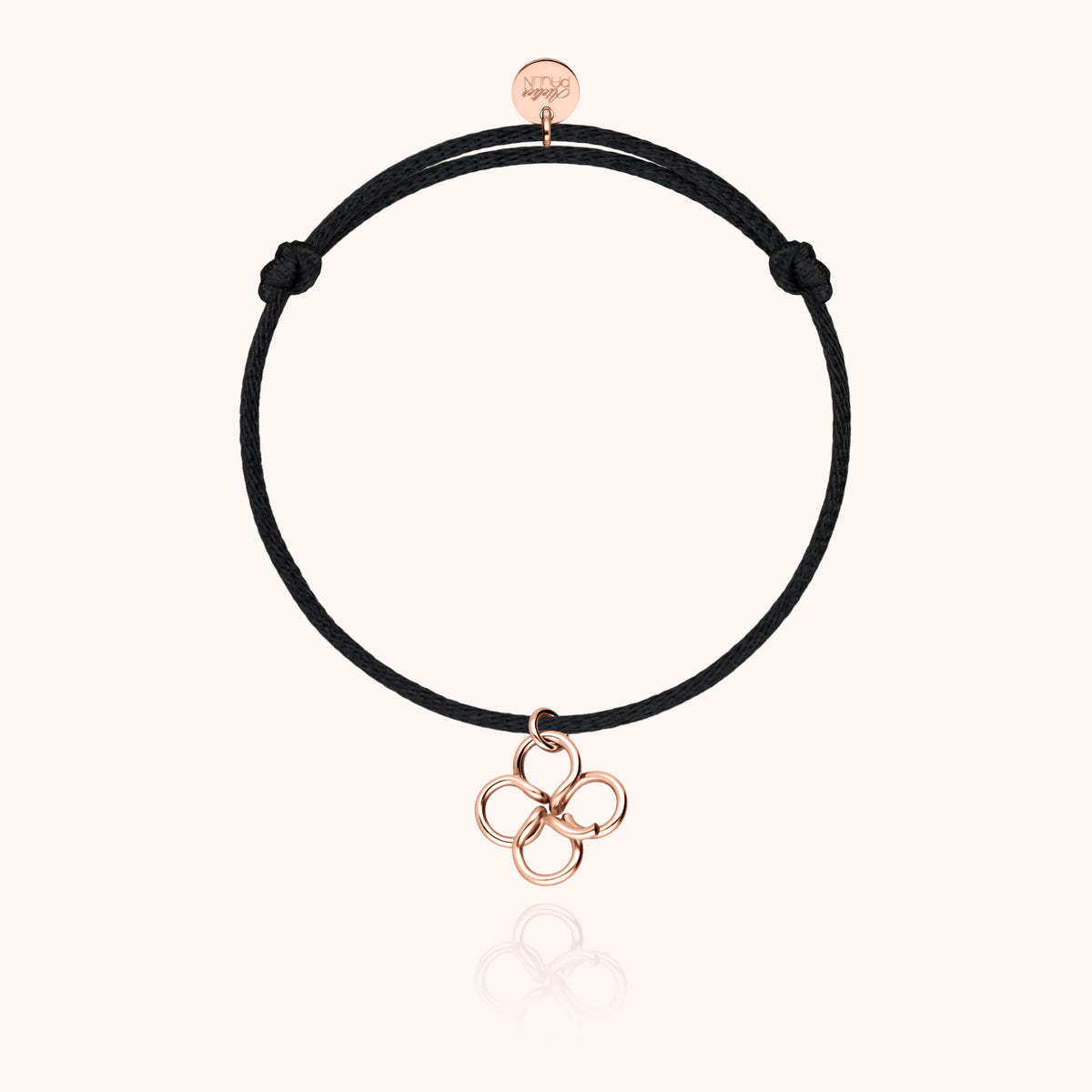 Bracelet cordon Lucky Charms trèfle en or rose 750 sur fond blanc