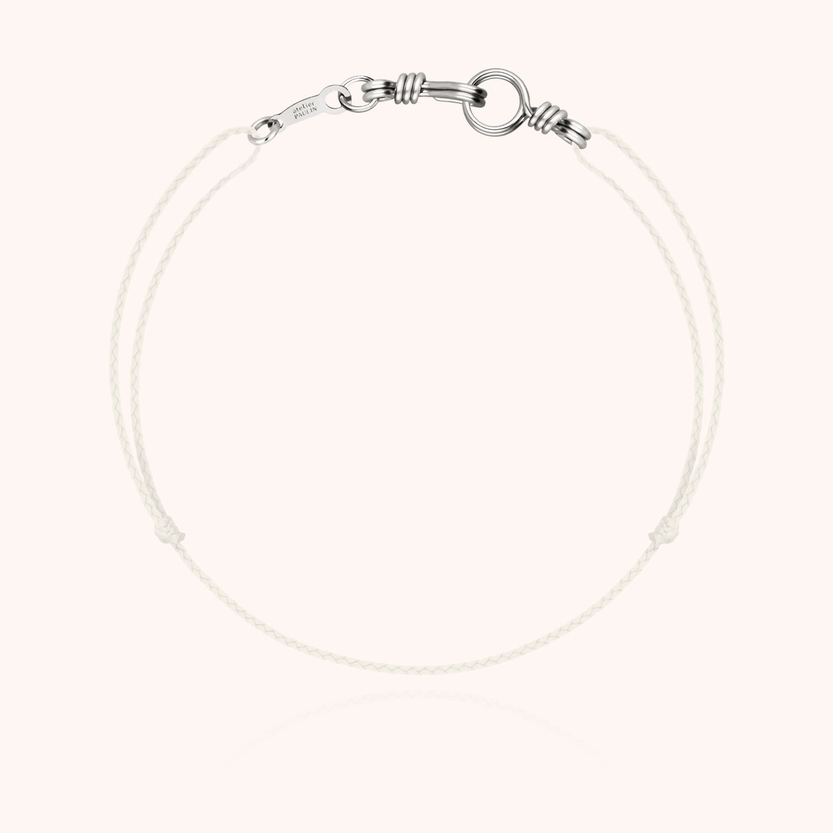 Overall view of the Cord Bracelet Mini Attache moi collection in 18k white gold wire