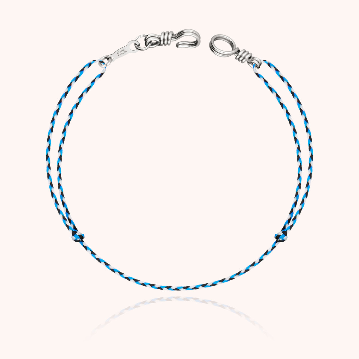 Cord Bracelet Mini Attache moi showing the adjustable synthetic cord