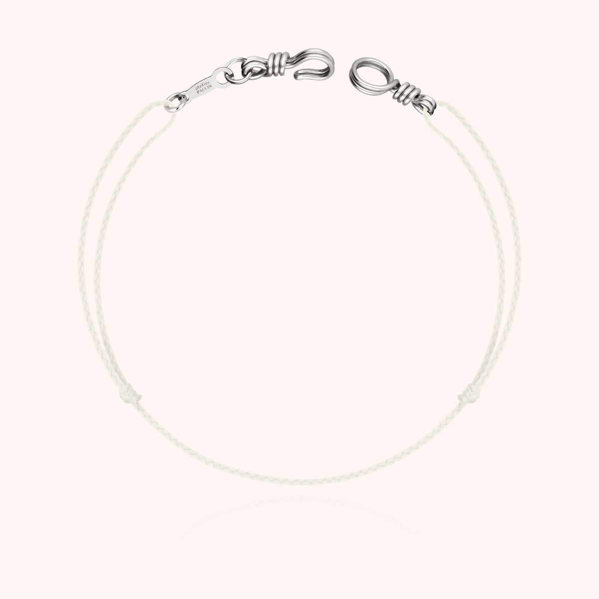 The Cord Bracelet Mini Attache moi in its Atelier Paulin gift box with the 18k gold hallmark certificate
