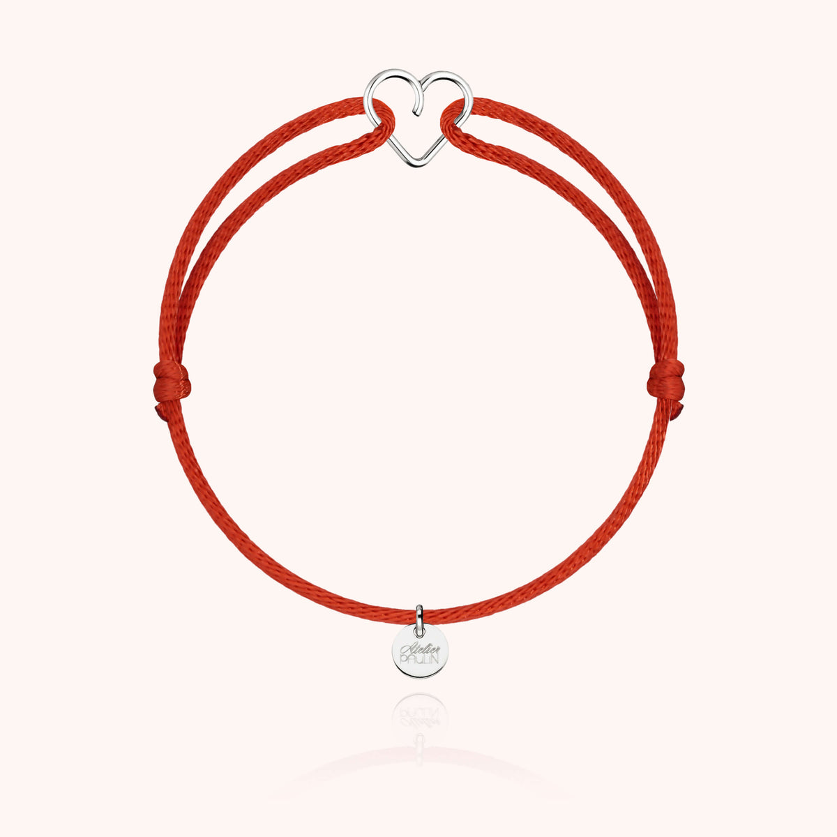 Atelier Paulin Verpackung mit Herz-Armband aus Silber und Kordel