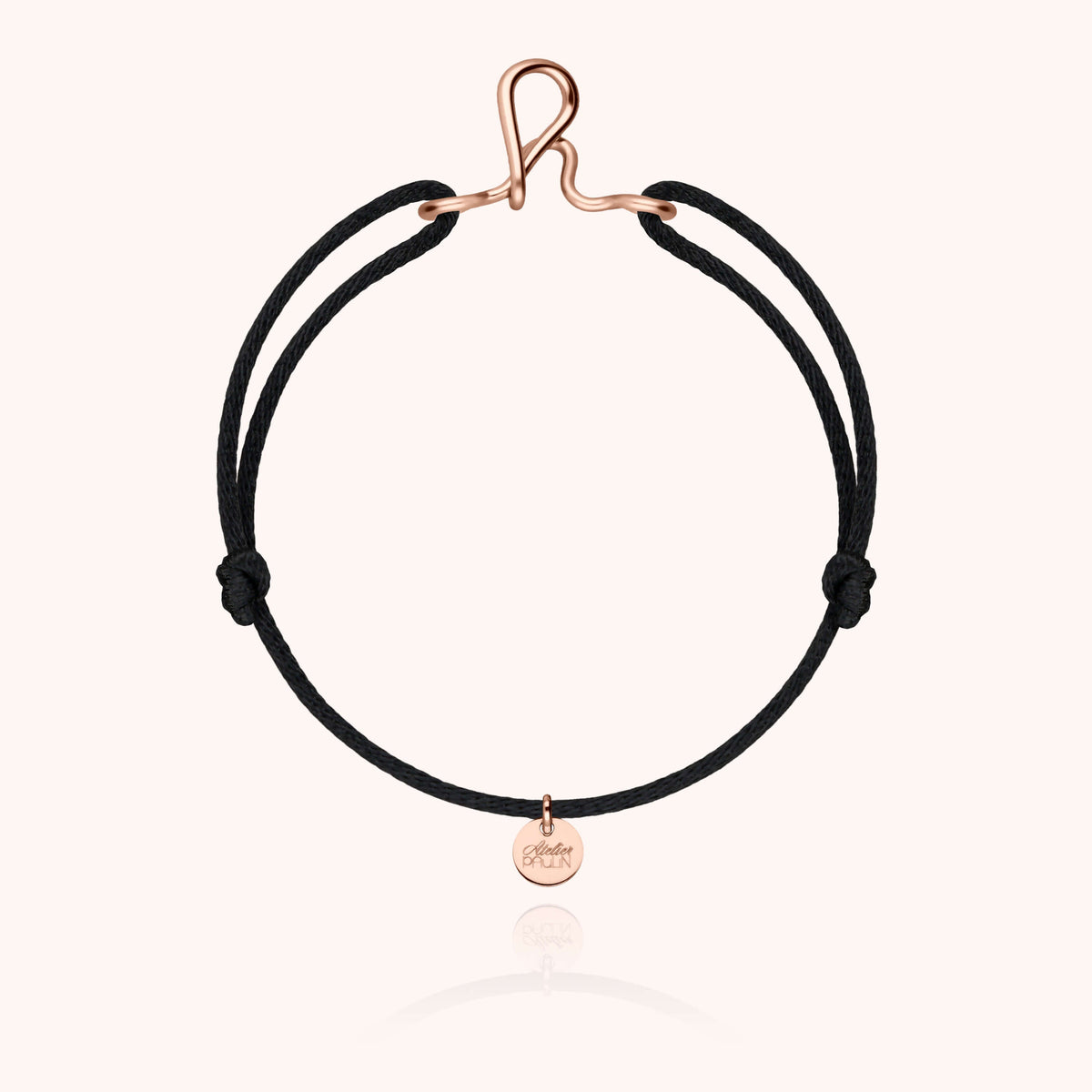 Detail of the hand-shaping on the Original Initiale Cord Bracelet in 14k rose gold-filled wire