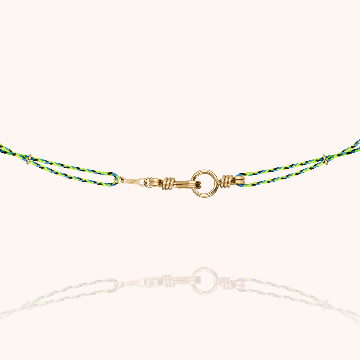 Close-up of the clasp on the Slim Knot Cord Necklace Attache moi in 14k yellow gold-filled wire