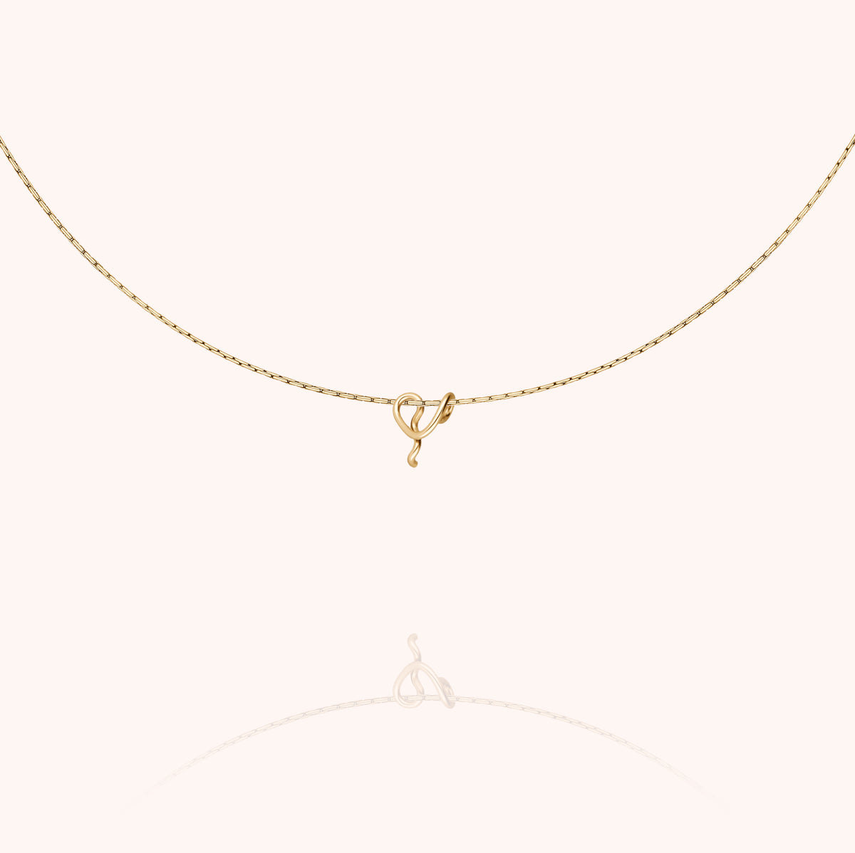 Original Initiale Necklace, worn around the neck