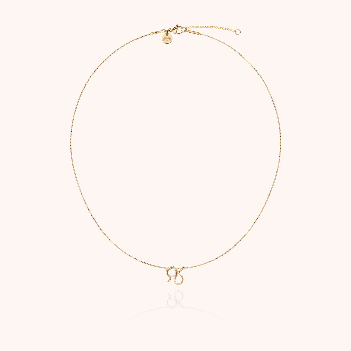 Original Initiale Necklace, worn around the neck