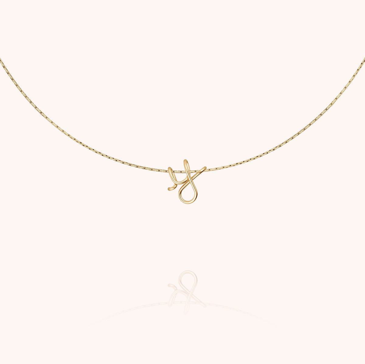 Original Initiale Necklace, worn around the neck