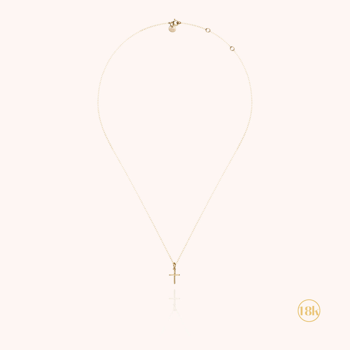Collana Charms Simbolico Croce in filo d'oro giallo 18kt, portata al collo