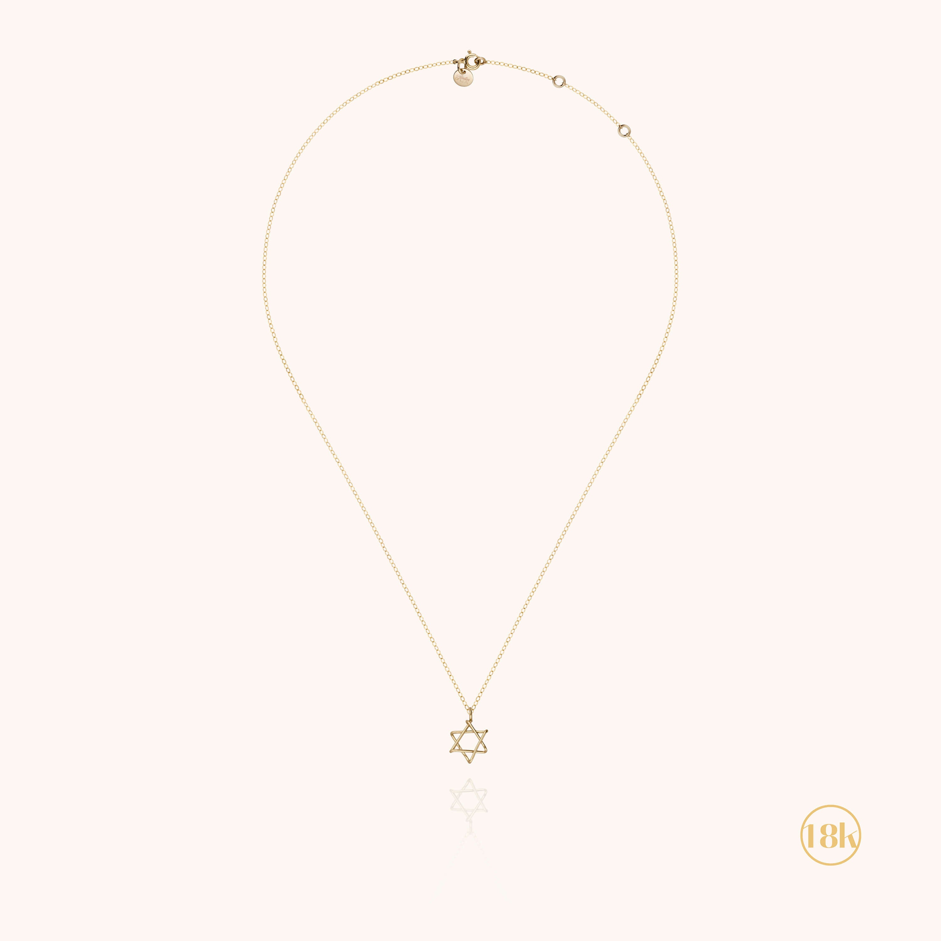 Collier étoile de David porté, or jaune 750 artisanat français parisien