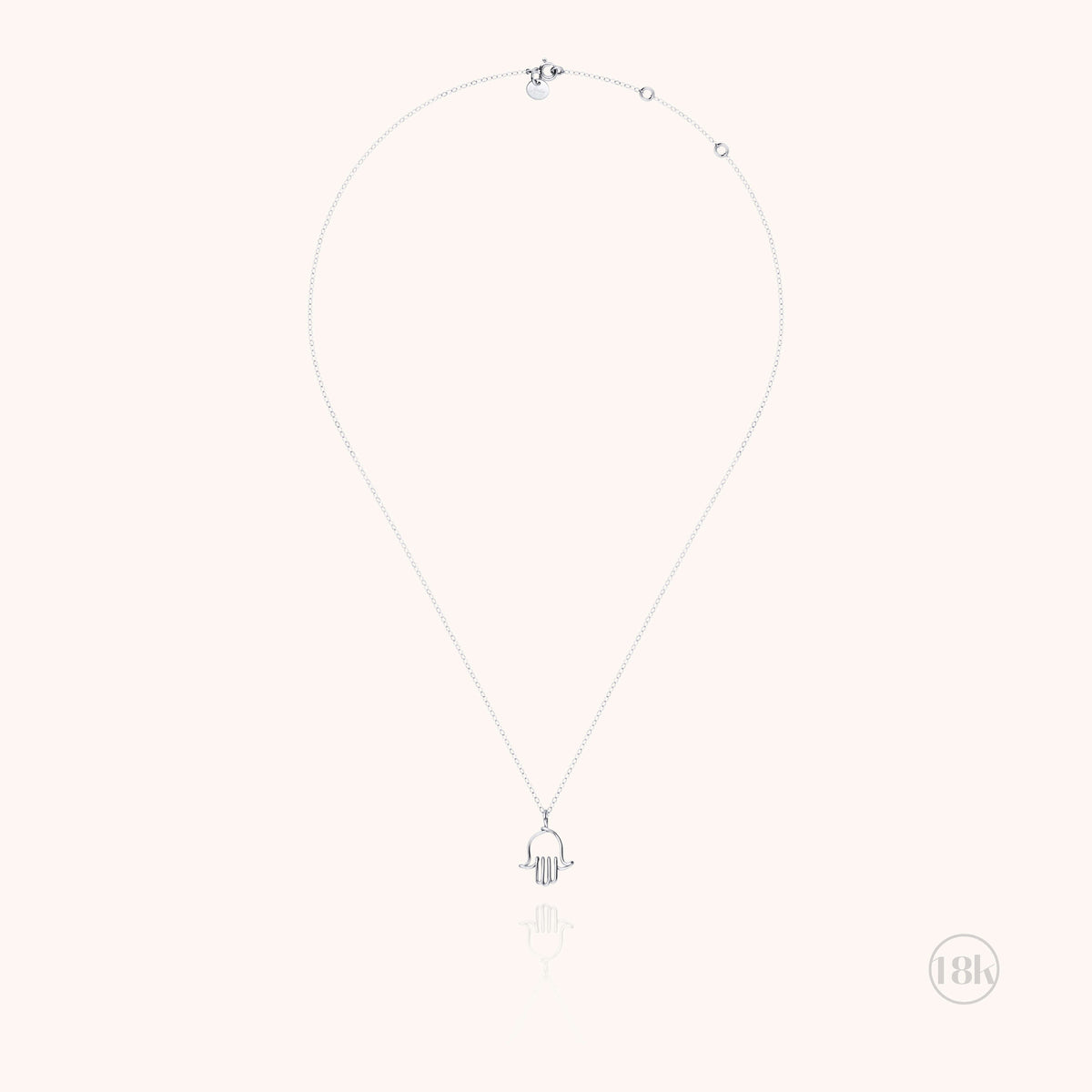 Detail of the Hand of Fatima charm in 18k white gold wire on the Richelieu chain